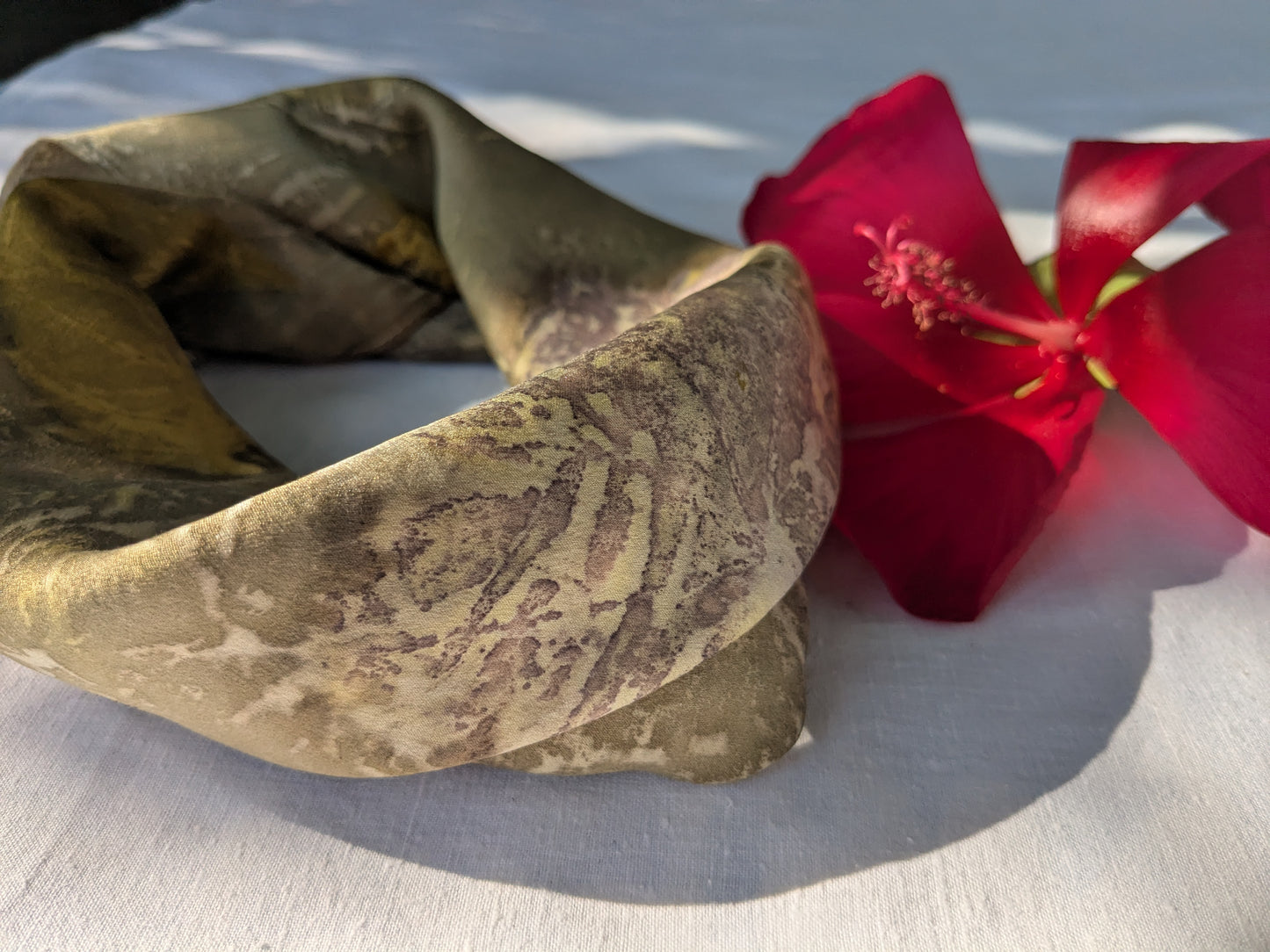 Pomegranate dyed silk scarf, eco printed with geranium leaves