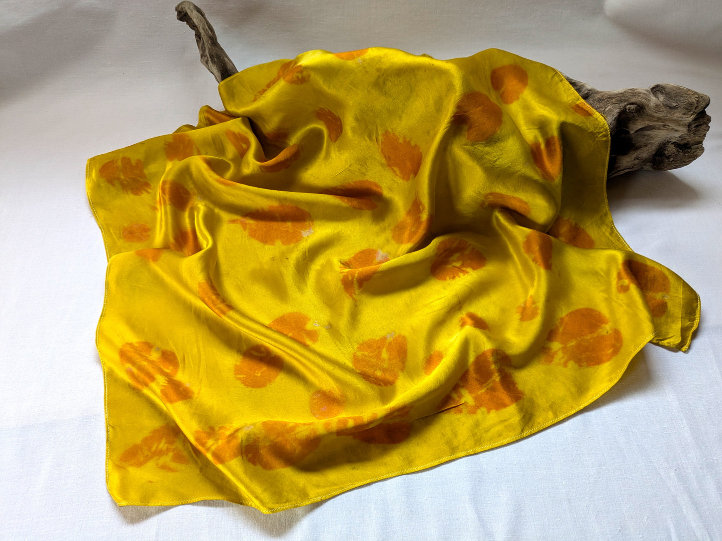 Eco printed yellow silk scarf with eucalyptus leaves