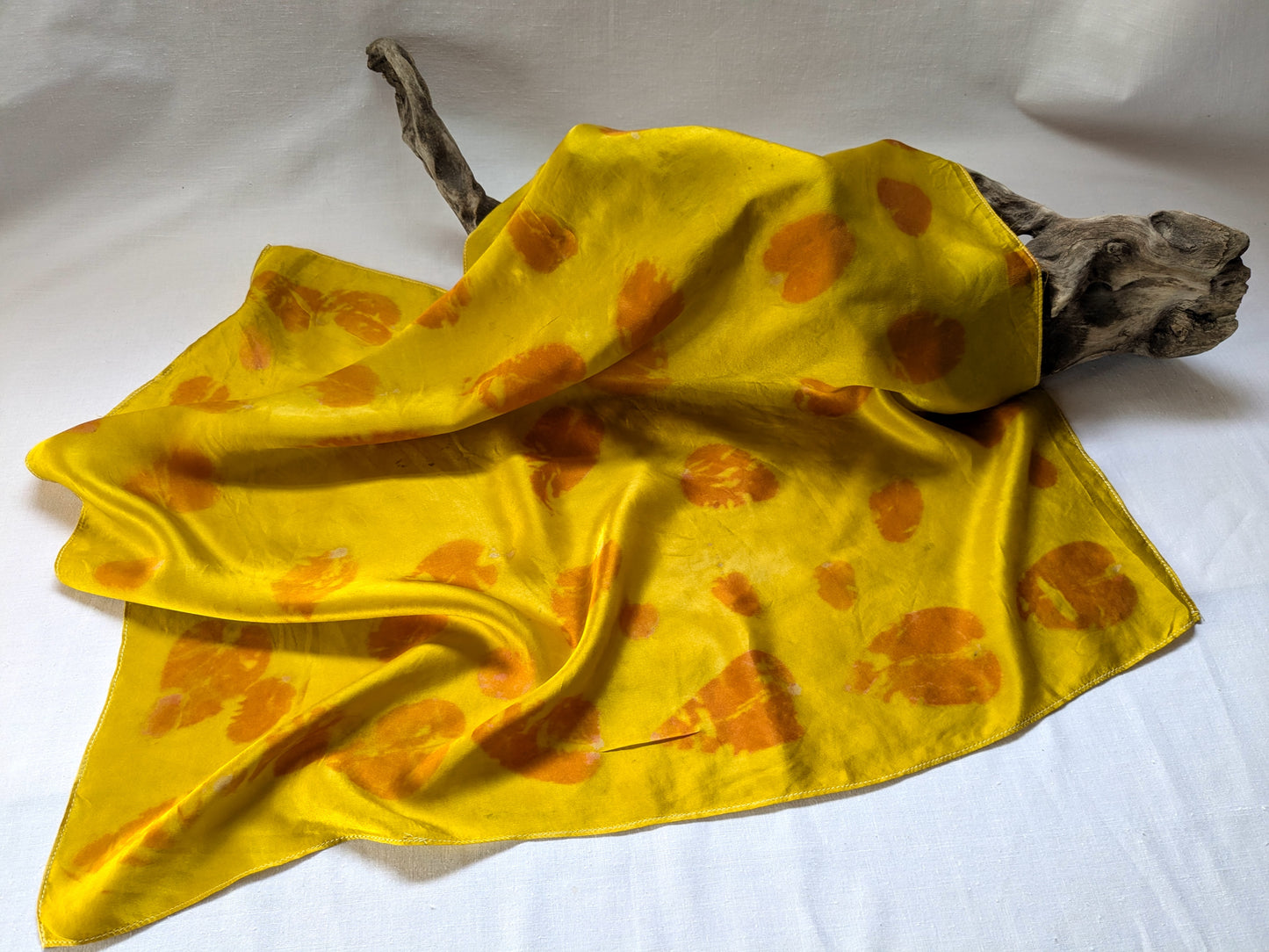 Eco printed yellow silk scarf with eucalyptus leaves