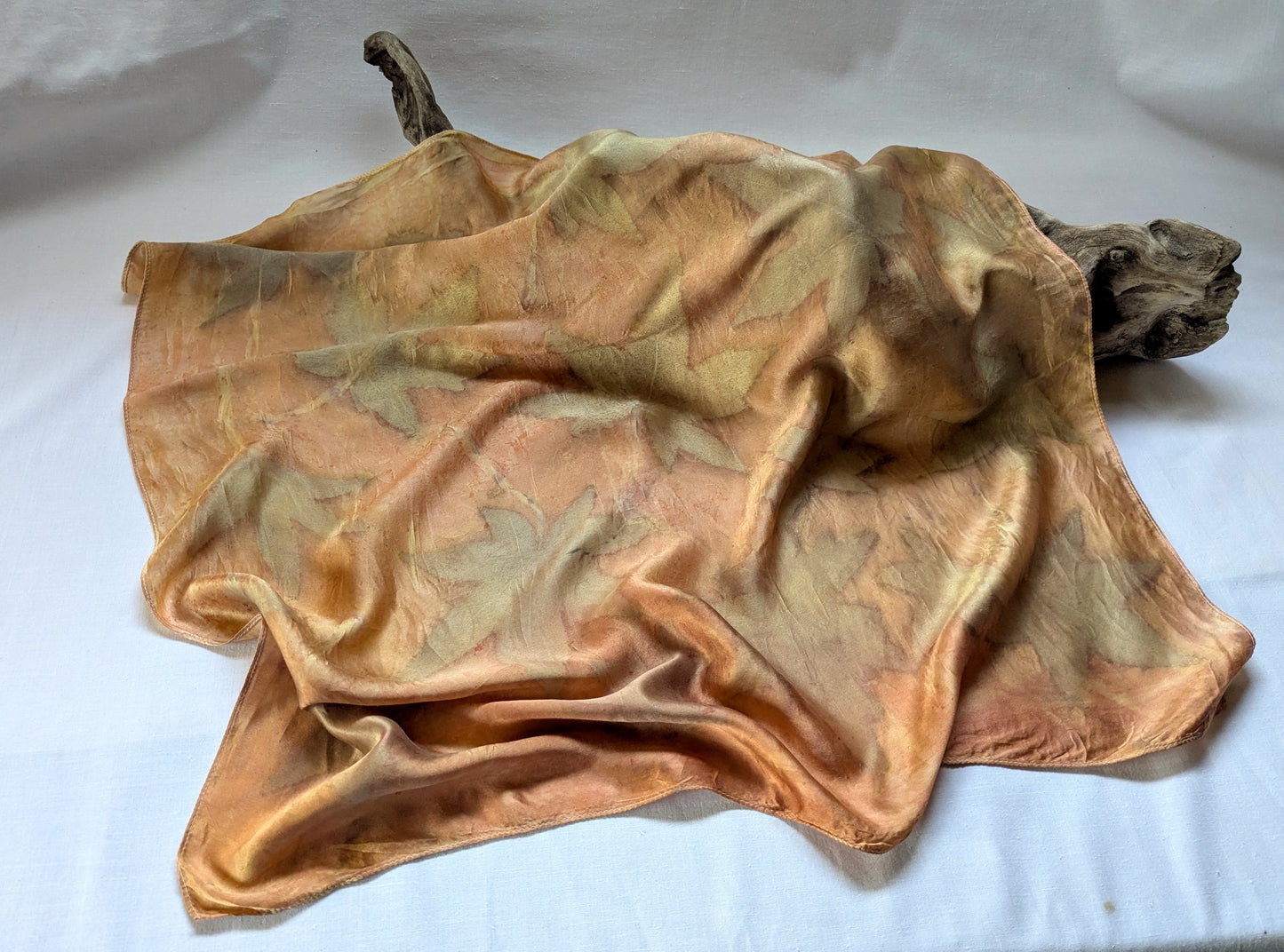 Orange colored silk satin scarf, eco printed with leaves