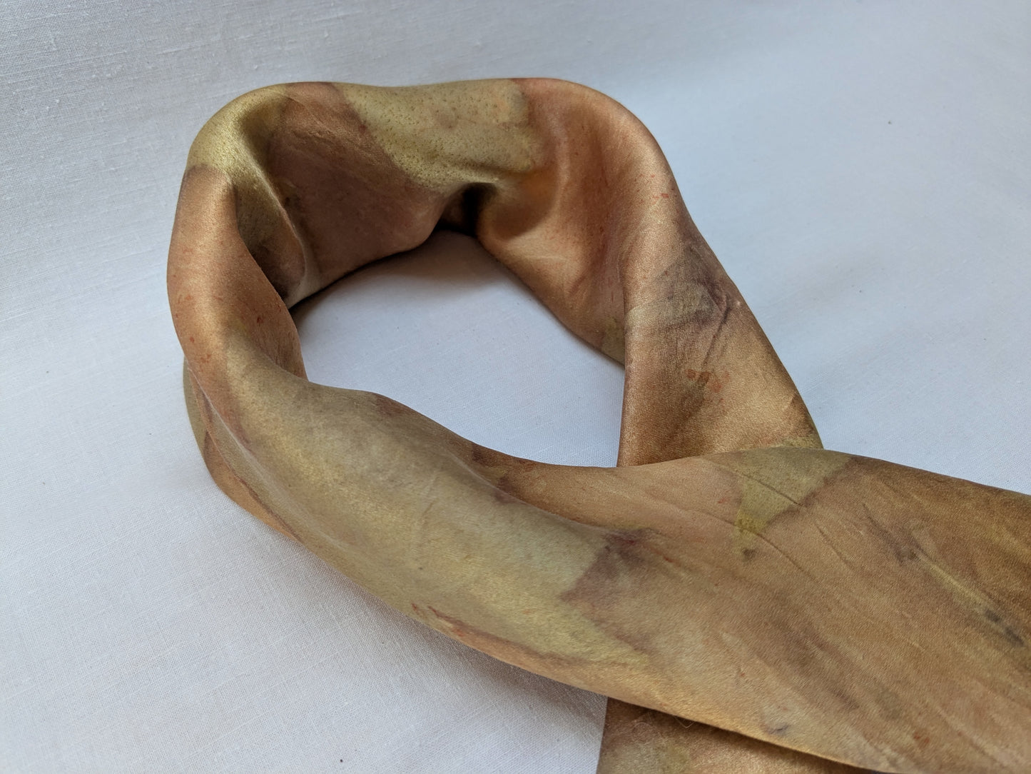 Orange colored silk satin scarf, eco printed with leaves