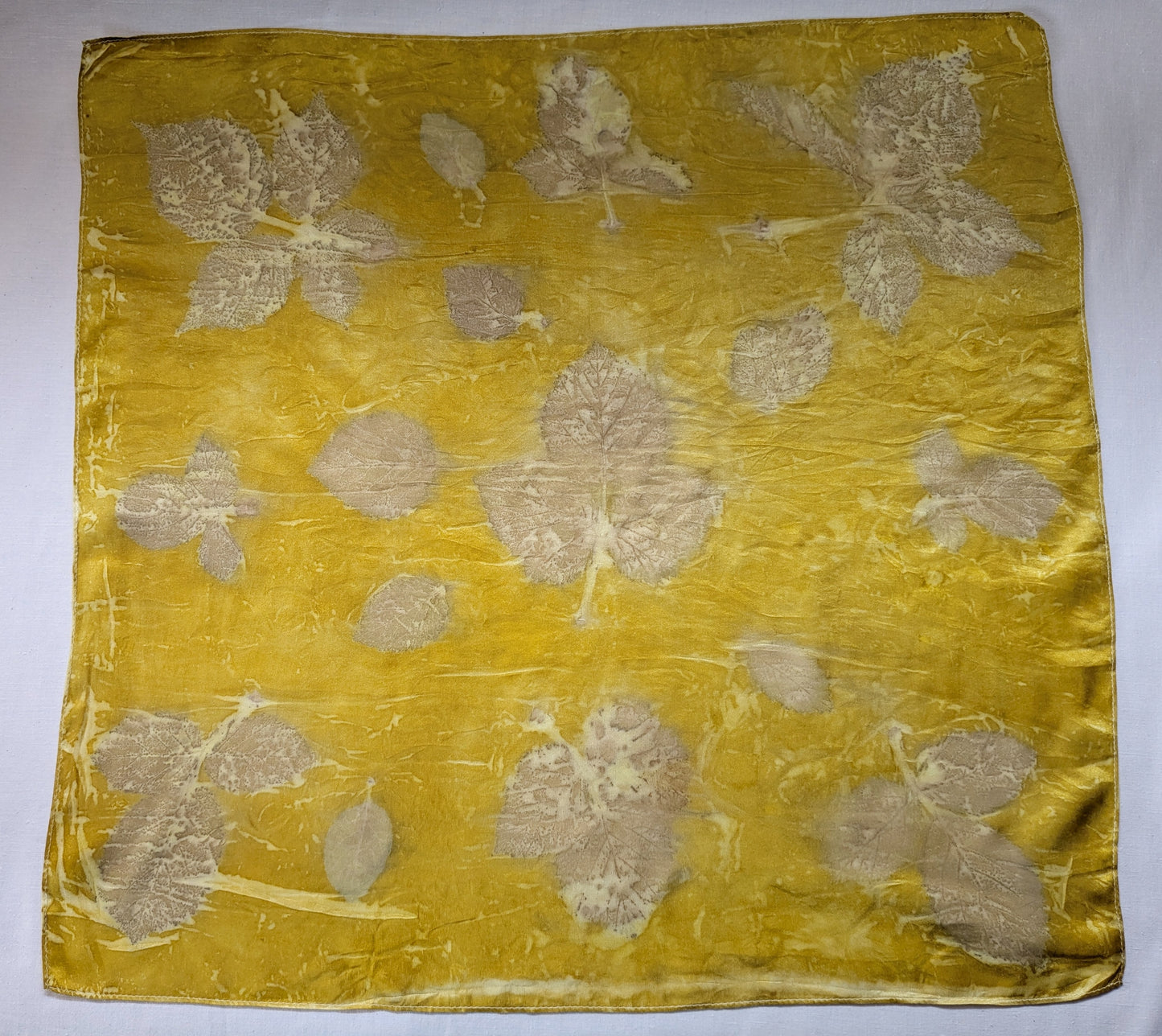 Marigold dyed natural silk scarf, eco printed with blackberry leaves